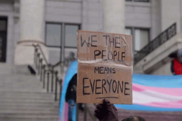 we trhe people mean everyone sign at a transgender rights rally.