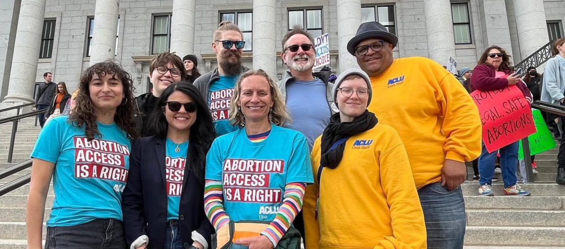 ACLU OF Utah staff members on the front steps of the Utah Capitol Building.